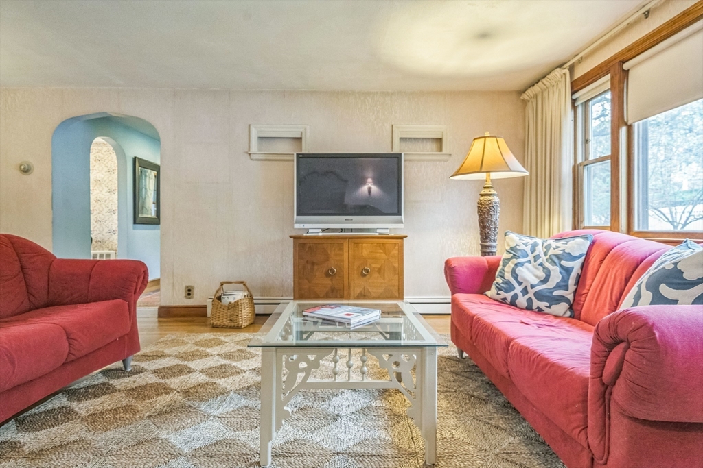 171 Virginia Road Waltham, MA 02453 - Photo 8 of 25 a living room with furniture and a window