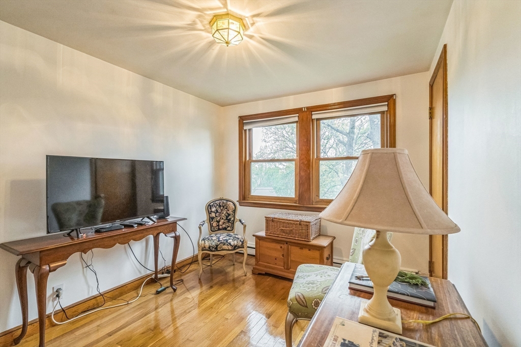 171 Virginia Road Waltham, MA 02453 - Photo 10 of 25 a living room with furniture and a flat screen tv