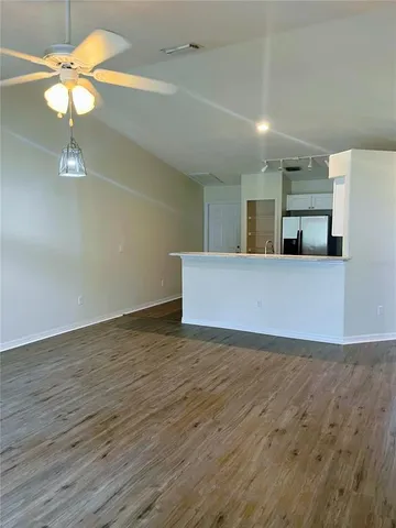 a view of a kitchen with a sink and window