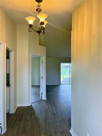 a kitchen with granite countertop a sink and cabinets