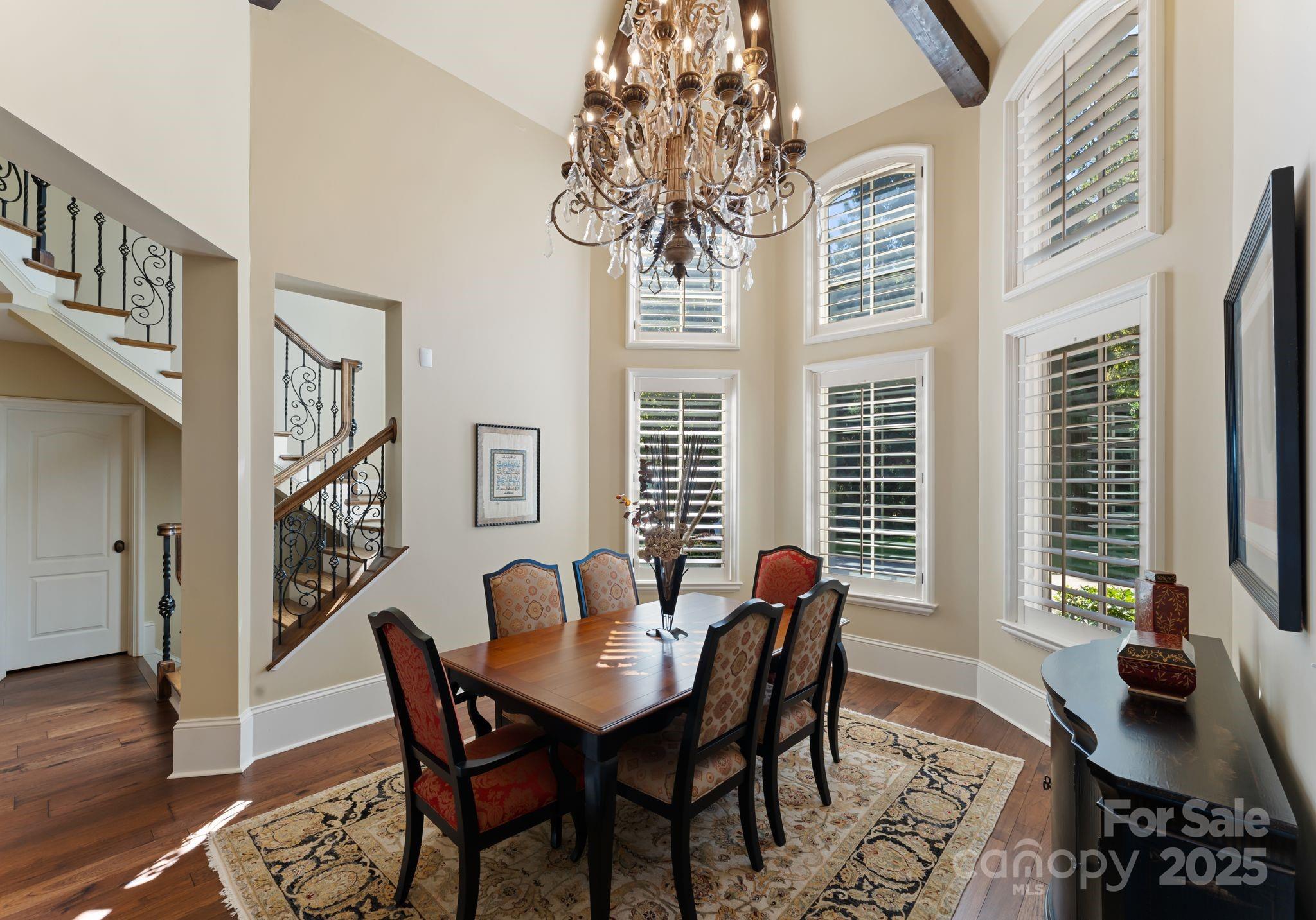 115 Emerald Point Lane Mooresville, NC 28117 - Photo 13 of 38 a view of a dining room with furniture window and wooden floor