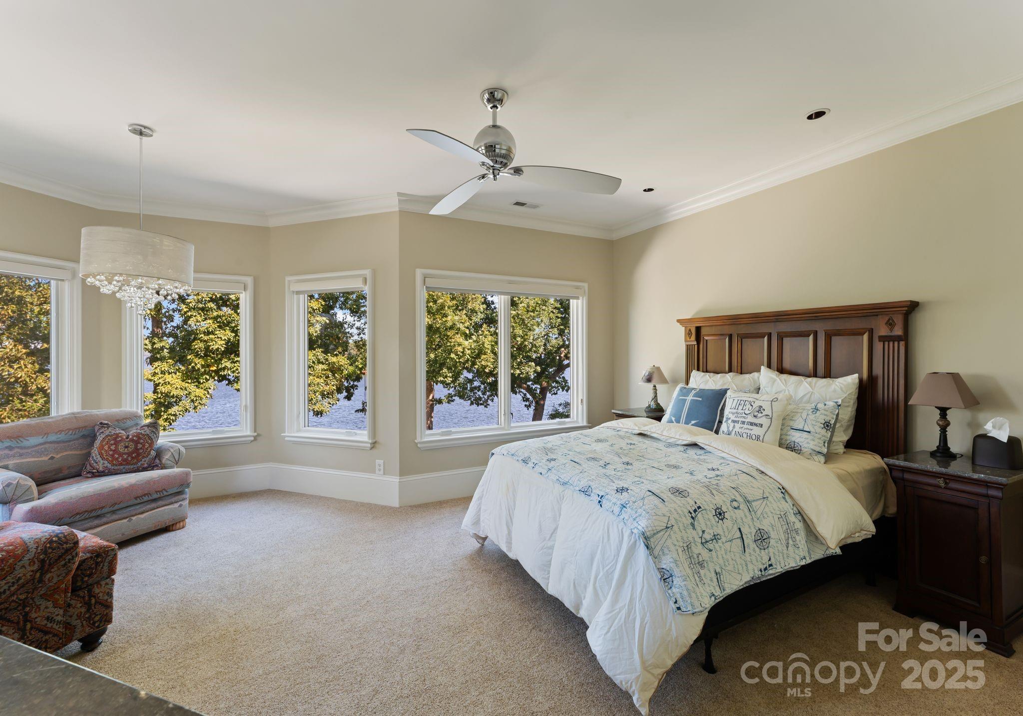 115 Emerald Point Lane Mooresville, NC 28117 - Photo 17 of 38 a large bed sitting in a bedroom next to a window