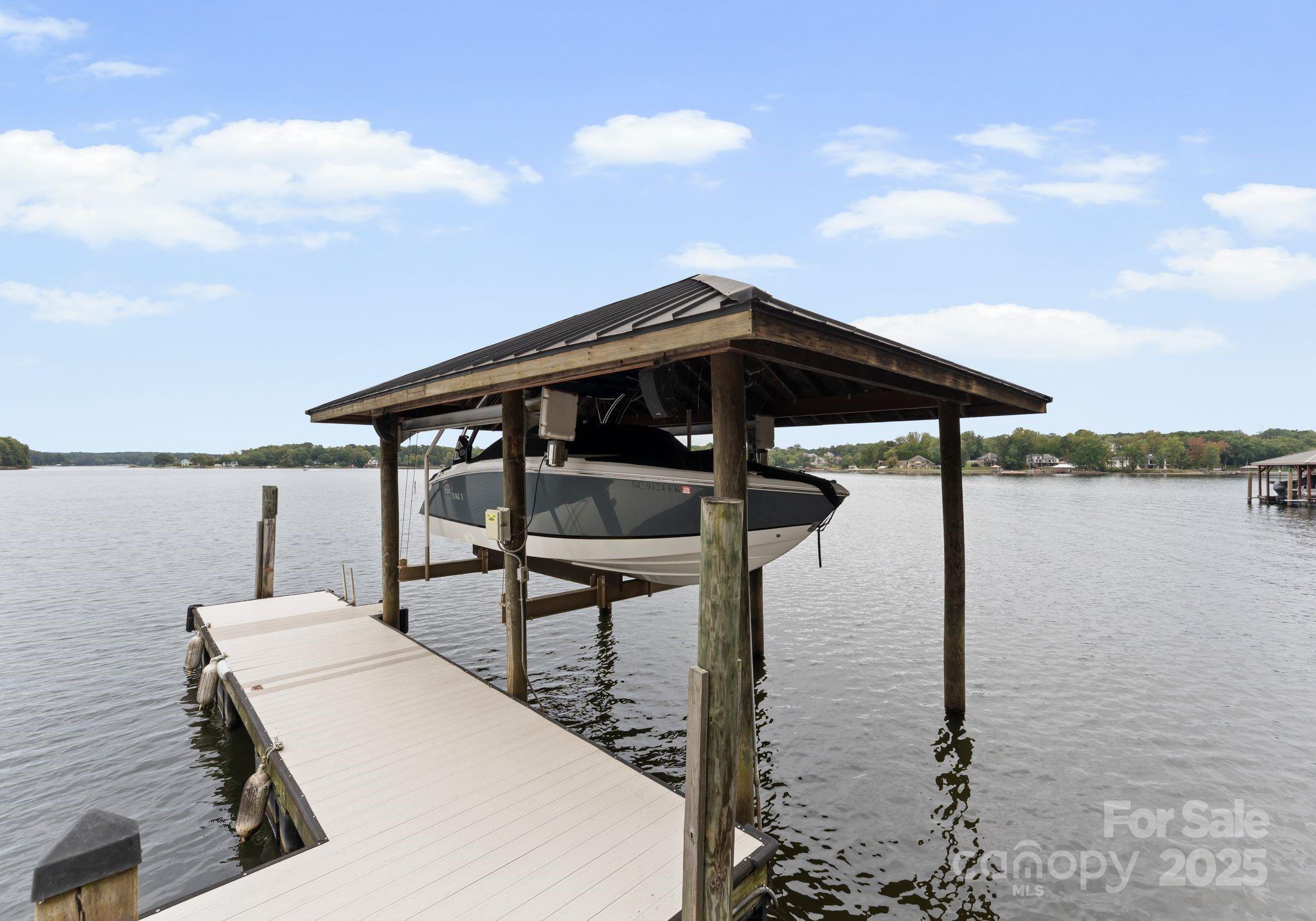 115 Emerald Point Lane Mooresville, NC 28117 - Photo 29 of 38 a roof deck with table and chairs