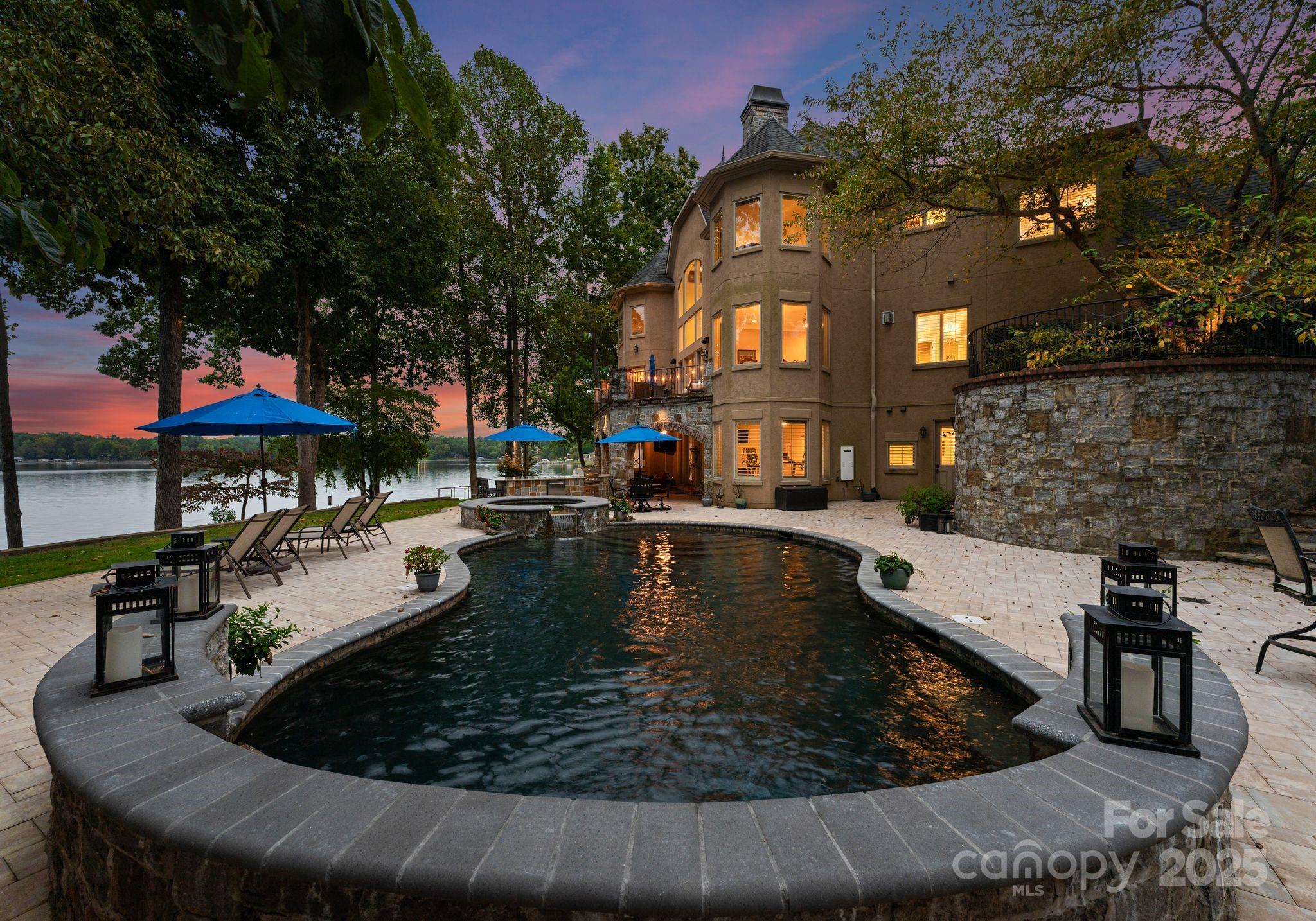 115 Emerald Point Lane Mooresville, NC 28117 - Photo 31 of 38 a view of a house with pool and chairs