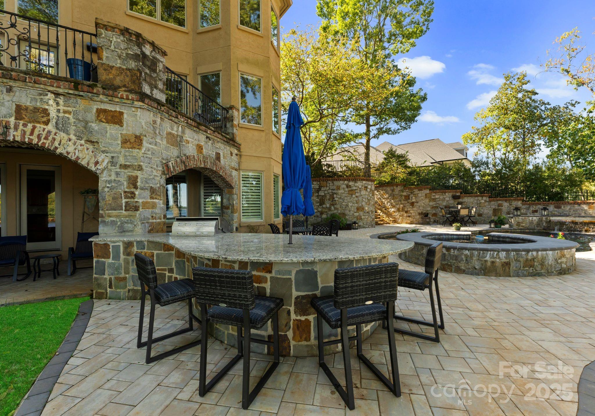 115 Emerald Point Lane Mooresville, NC 28117 - Photo 32 of 38 a view of a patio with table and chairs and potted plants