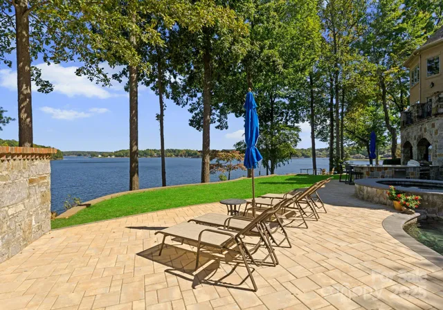 a view of a backyard with sitting area