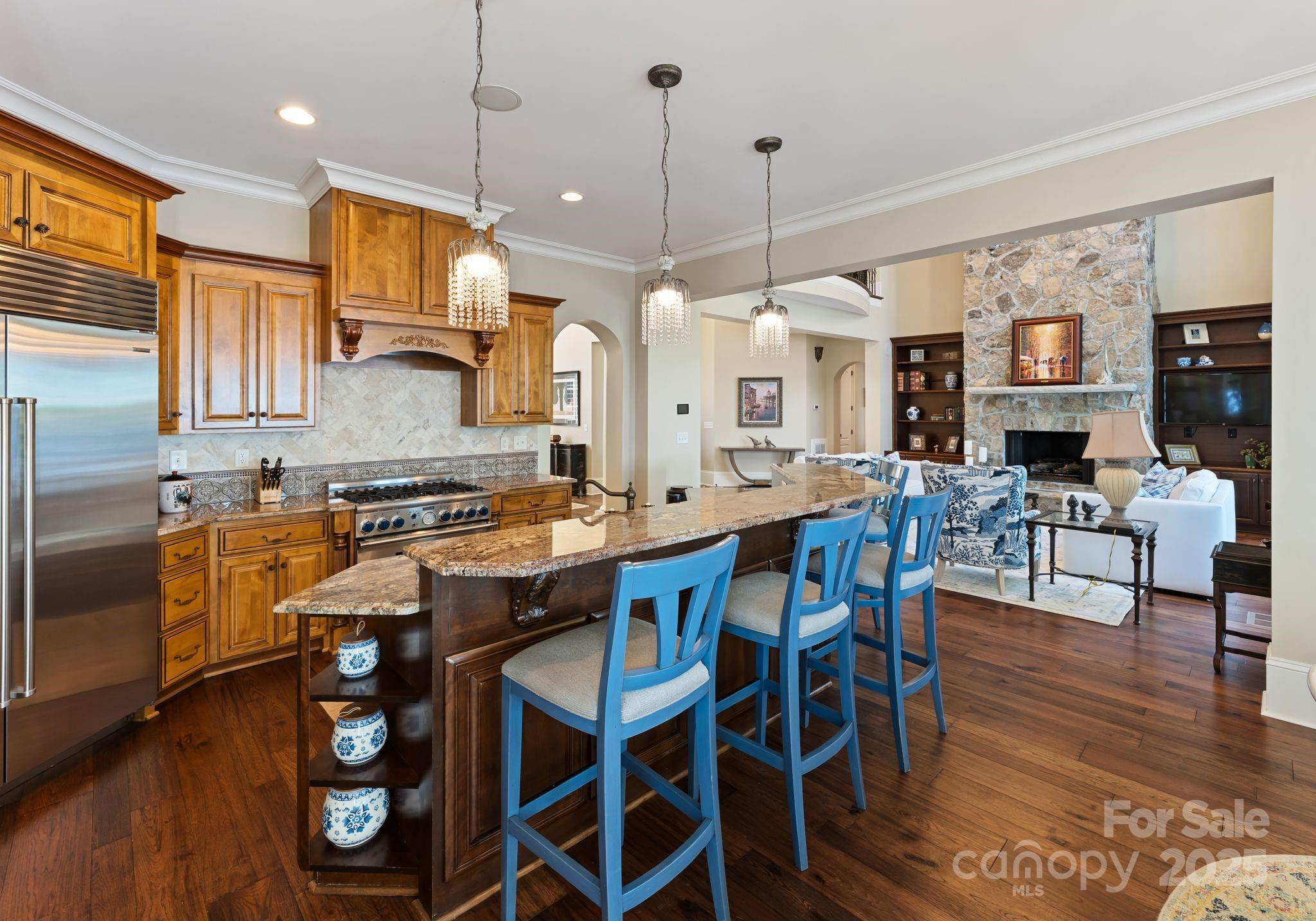 115 Emerald Point Lane Mooresville, NC 28117 - Photo 10 of 38 a large kitchen with lots of counter space and dining table