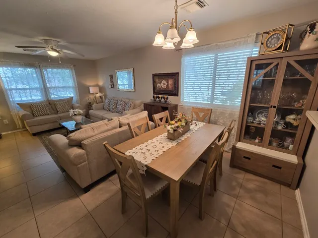 a dining room with furniture and window