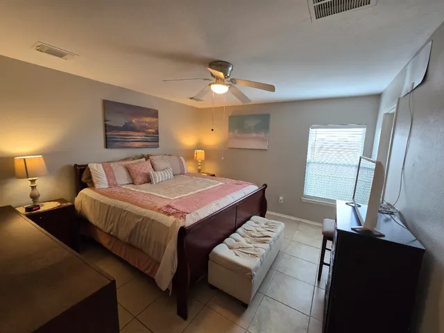 a bedroom with a bed and window