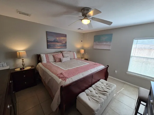 a view of a backyard with plants and a patio