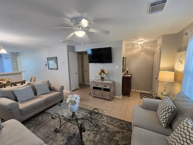a view of a dining room with furniture and window