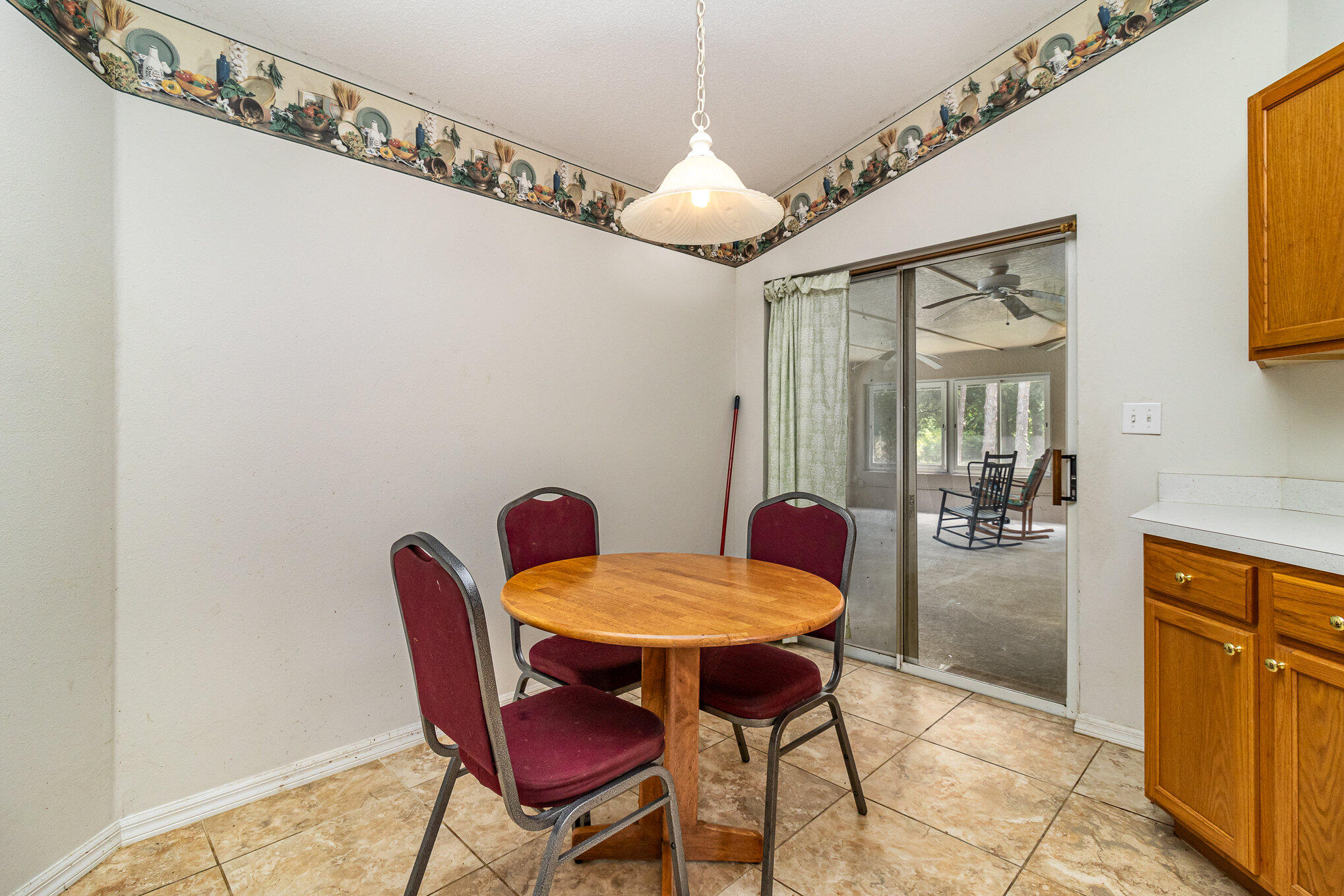 697 Furth Road Northwest Palm Bay, FL 32907 - Photo 7 of 24 a dining room with furniture and chandelier