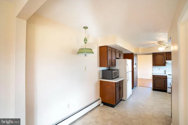 a kitchen with stainless steel appliances a refrigerator and a sink
