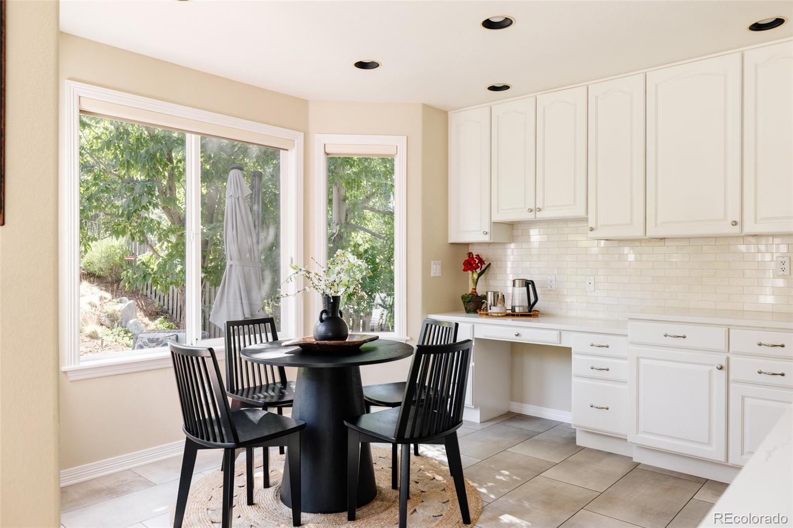 1347 Pine View Road Golden, CO 80403 - Photo 15 of 50 a view of a dining room with furniture window and outside view