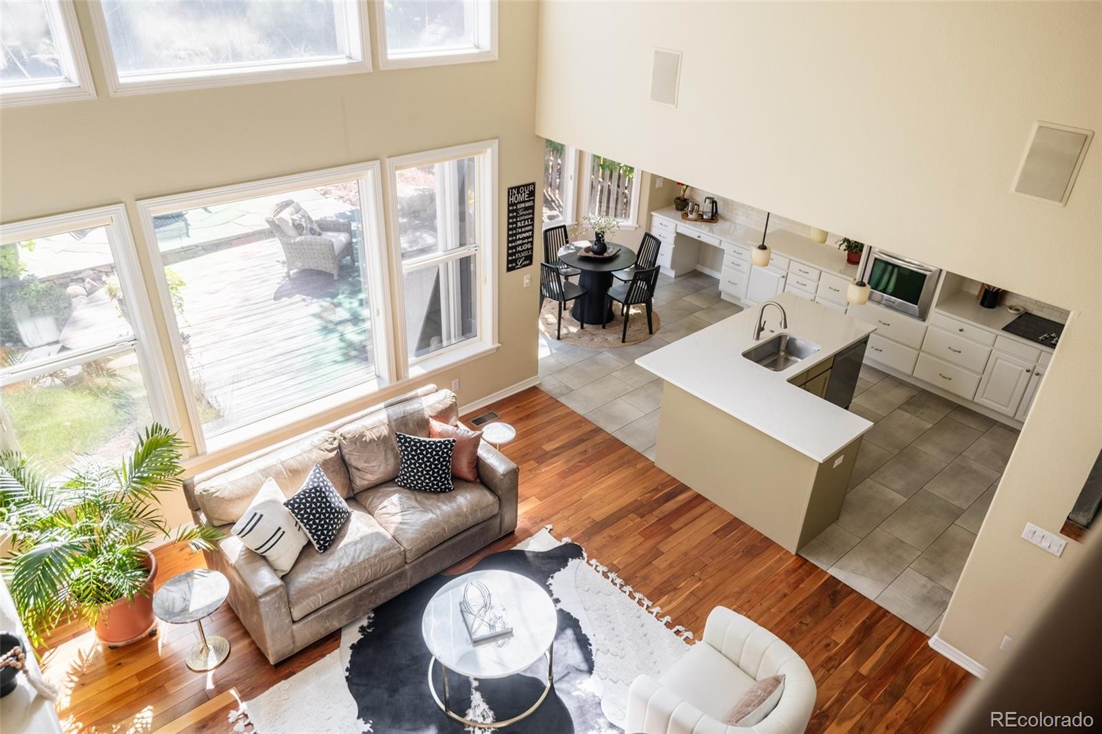 1347 Pine View Road Golden, CO 80403 - Photo 17 of 50 a living room with furniture and a floor to ceiling window