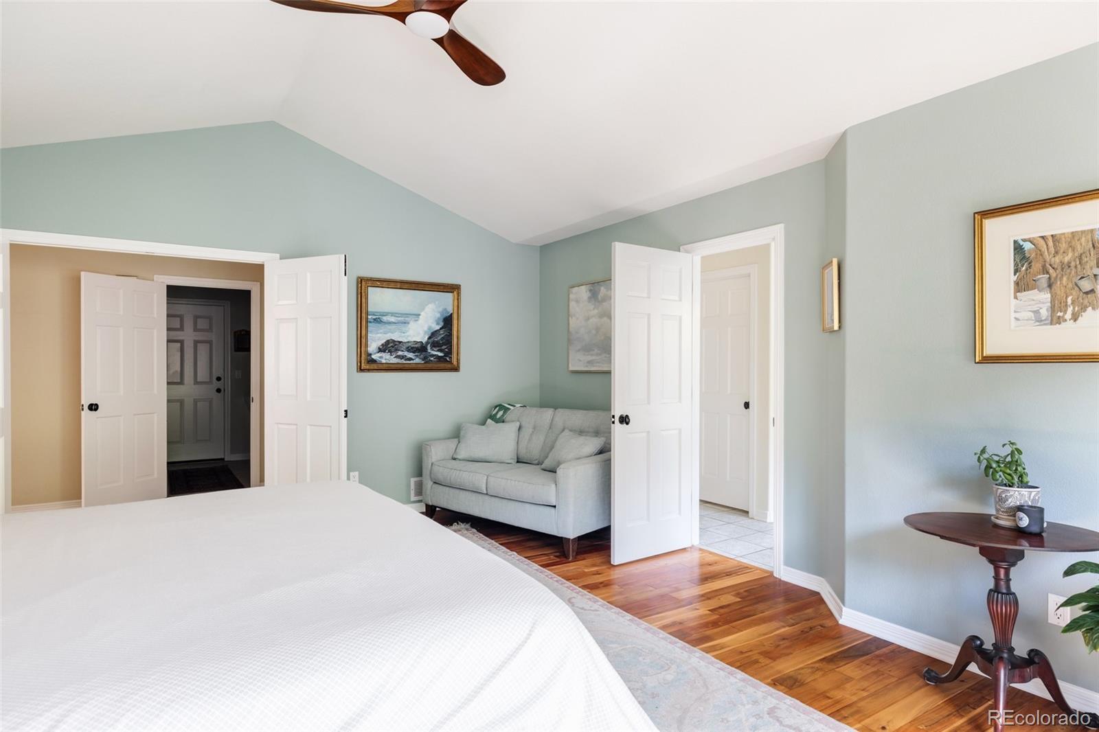 1347 Pine View Road Golden, CO 80403 - Photo 19 of 50 a bedroom with a bed and a couch