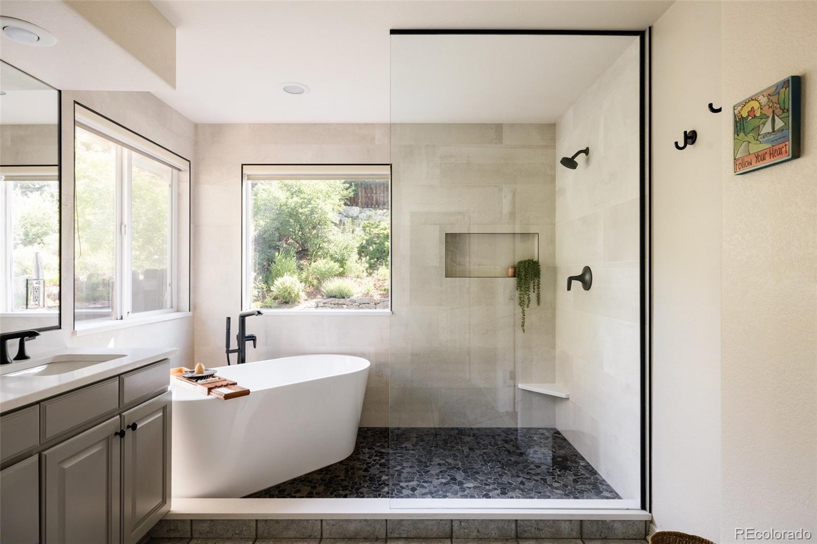 1347 Pine View Road Golden, CO 80403 - Photo 21 of 50 a bathroom with a bathtub and sink