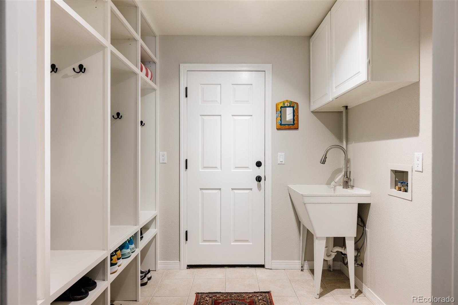 1347 Pine View Road Golden, CO 80403 - Photo 25 of 50 a bathroom with a sink a mirror and a shower