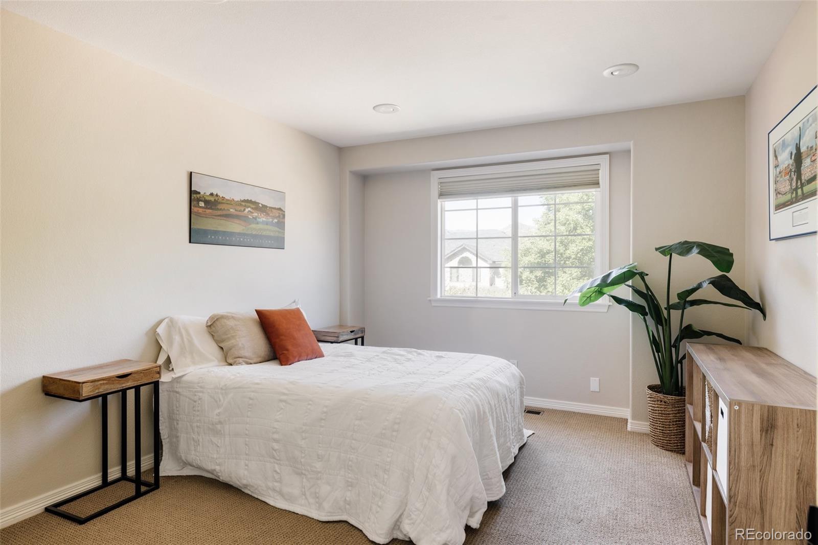 1347 Pine View Road Golden, CO 80403 - Photo 28 of 50 a bedroom with a bed and a window