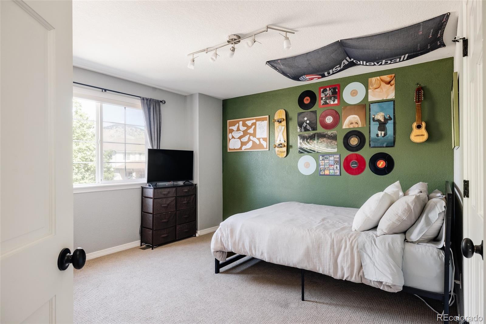 1347 Pine View Road Golden, CO 80403 - Photo 29 of 50 a bedroom with a bed and a window