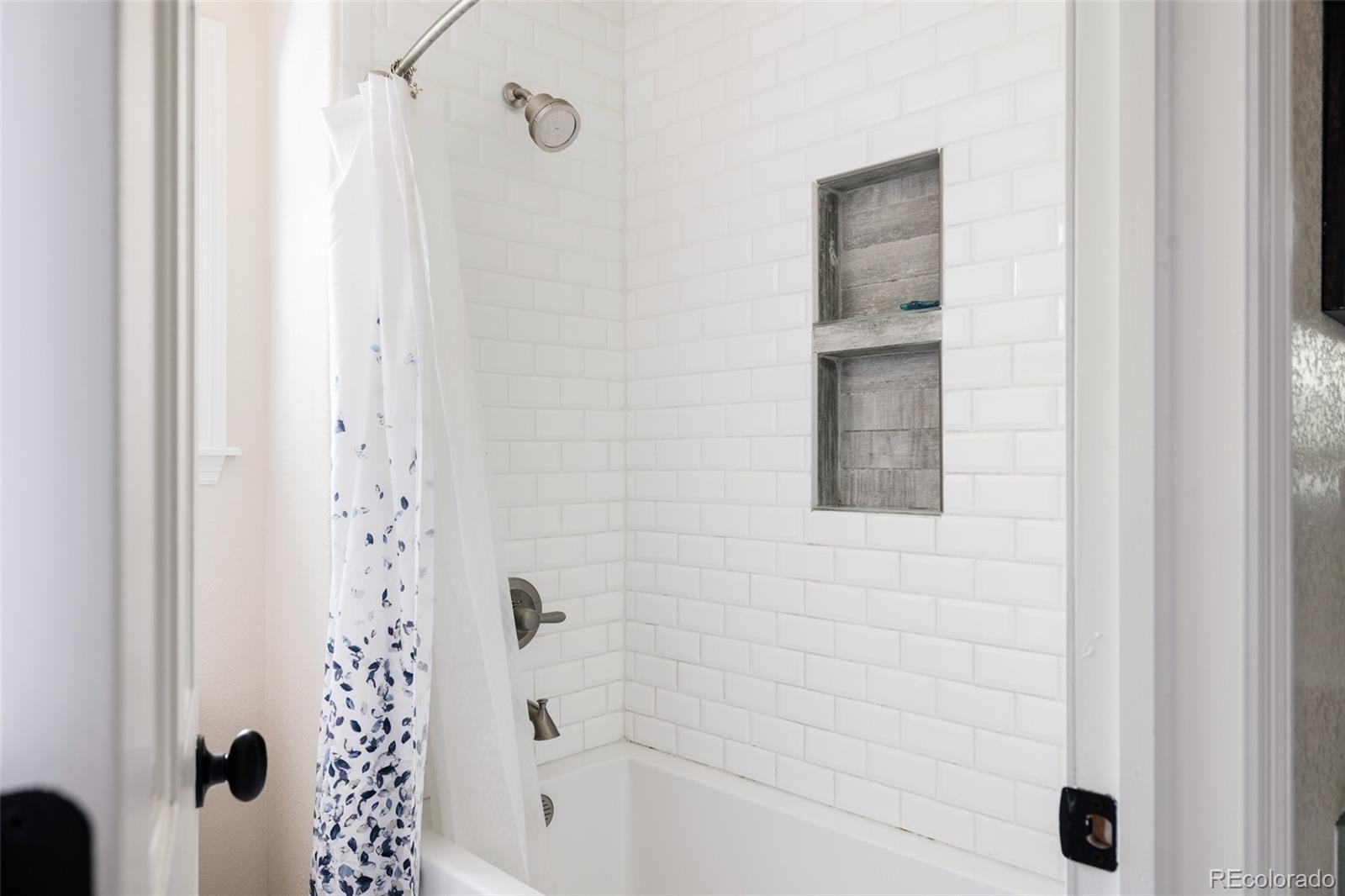 1347 Pine View Road Golden, CO 80403 - Photo 32 of 50 a bathroom with a bathtub and shower