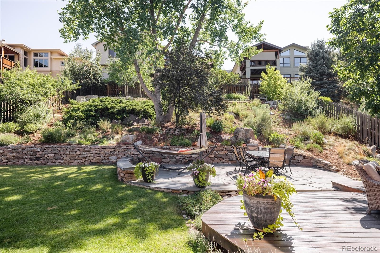 1347 Pine View Road Golden, CO 80403 - Photo 36 of 50 a front view of a house with a yard