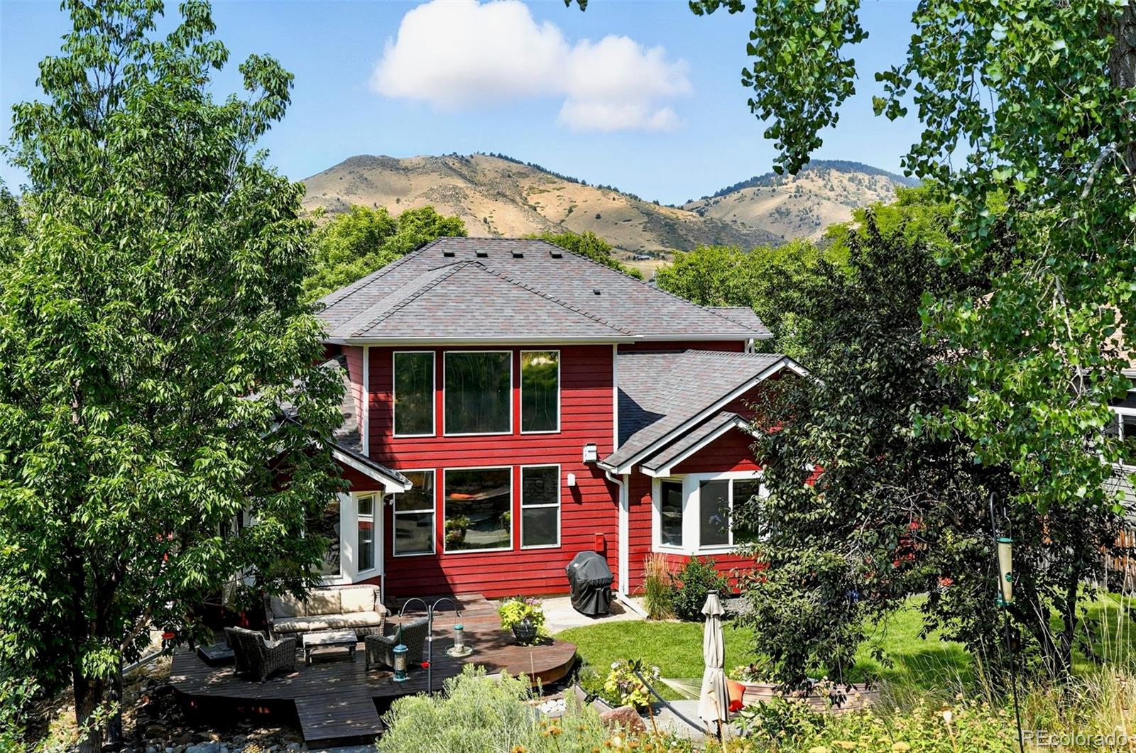 1347 Pine View Road Golden, CO 80403 - Photo 41 of 50 front view of a house with a yard