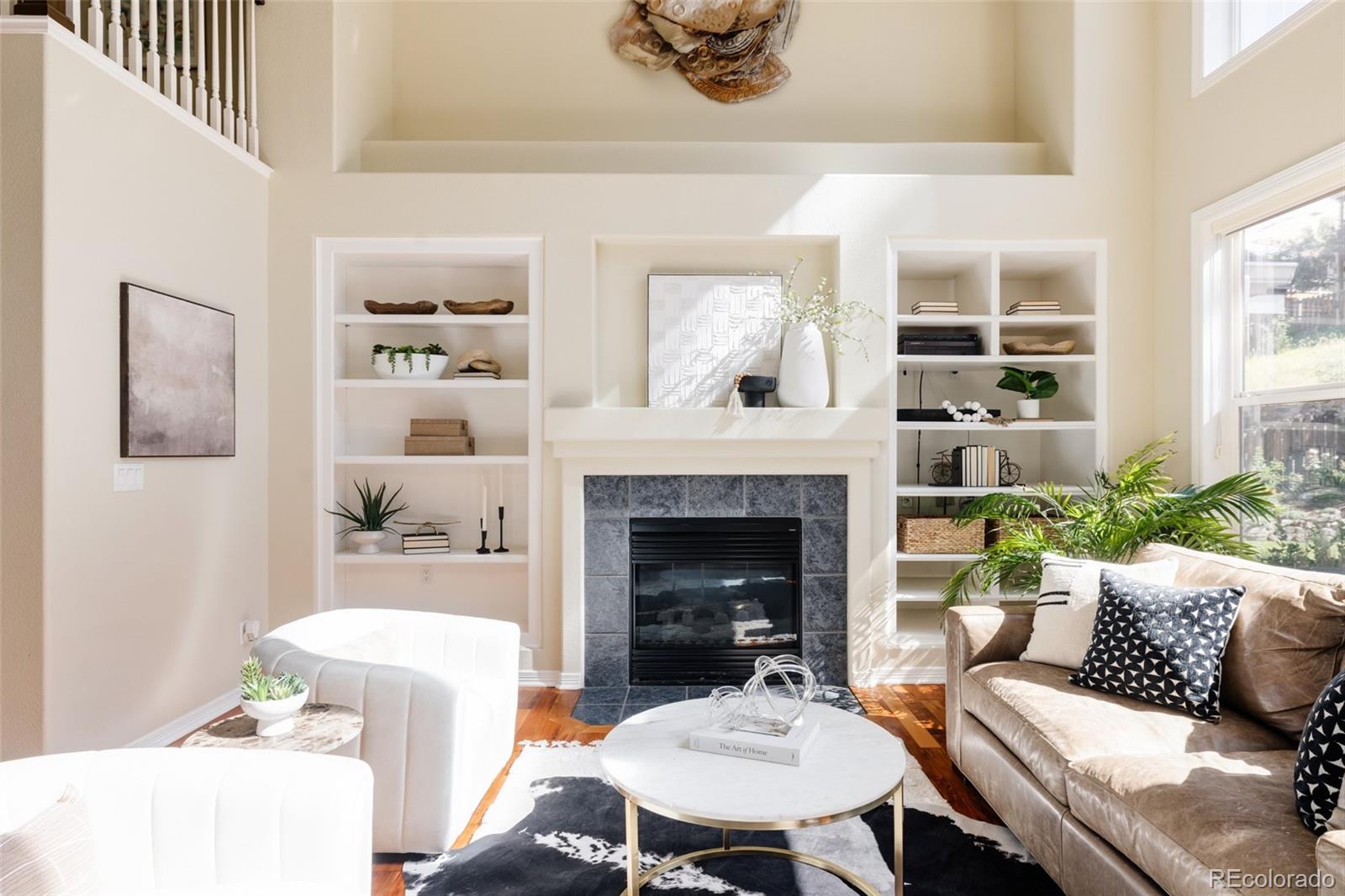 1347 Pine View Road Golden, CO 80403 - Photo 5 of 50 a living room with furniture and a fireplace