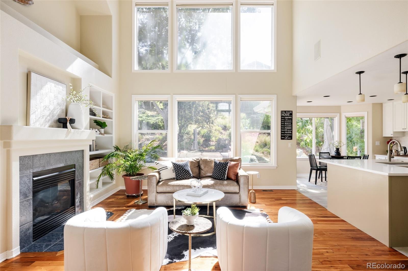 1347 Pine View Road Golden, CO 80403 - Photo 7 of 50 a living room with fireplace furniture and a large window
