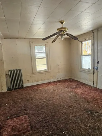 a room with a bed and a window