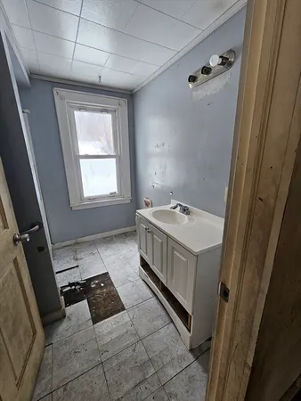 a kitchen with stainless steel appliances a stove a sink and a refrigerator