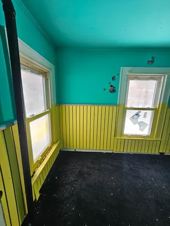 a bathroom with a tub a mirror and a shower
