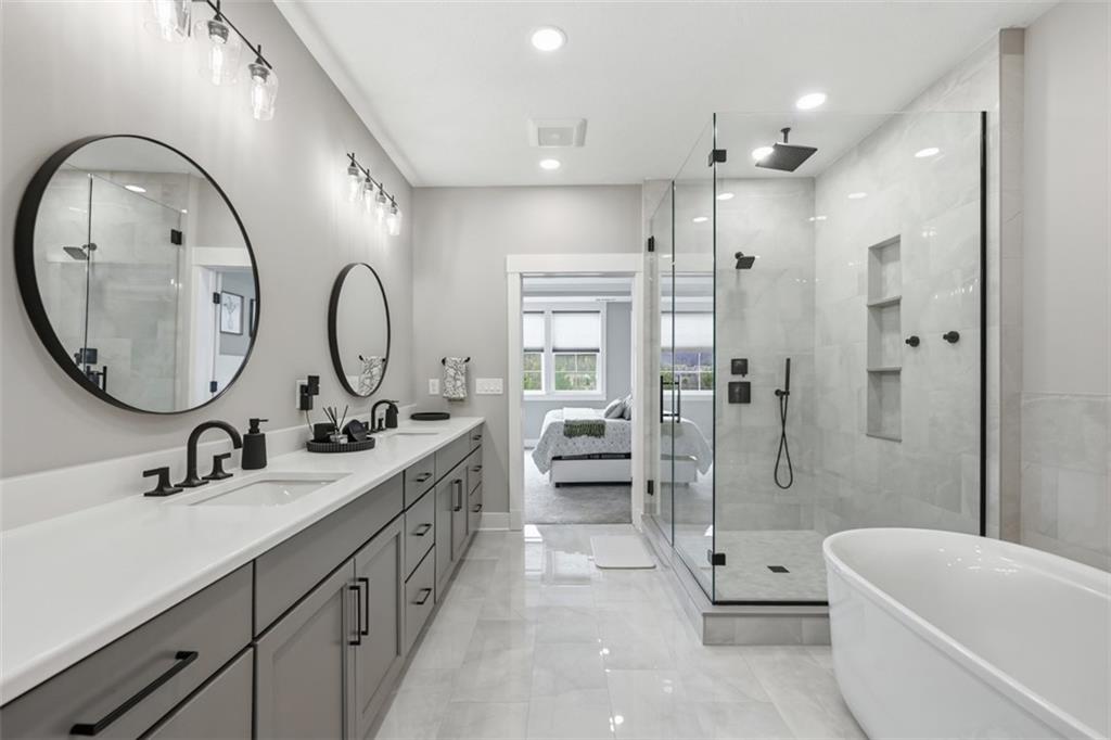 146 Enclave Drive Mars, PA 16046 - Photo 14 of 48 a bathroom with a double vanity sink a toilet a mirror and bathtub