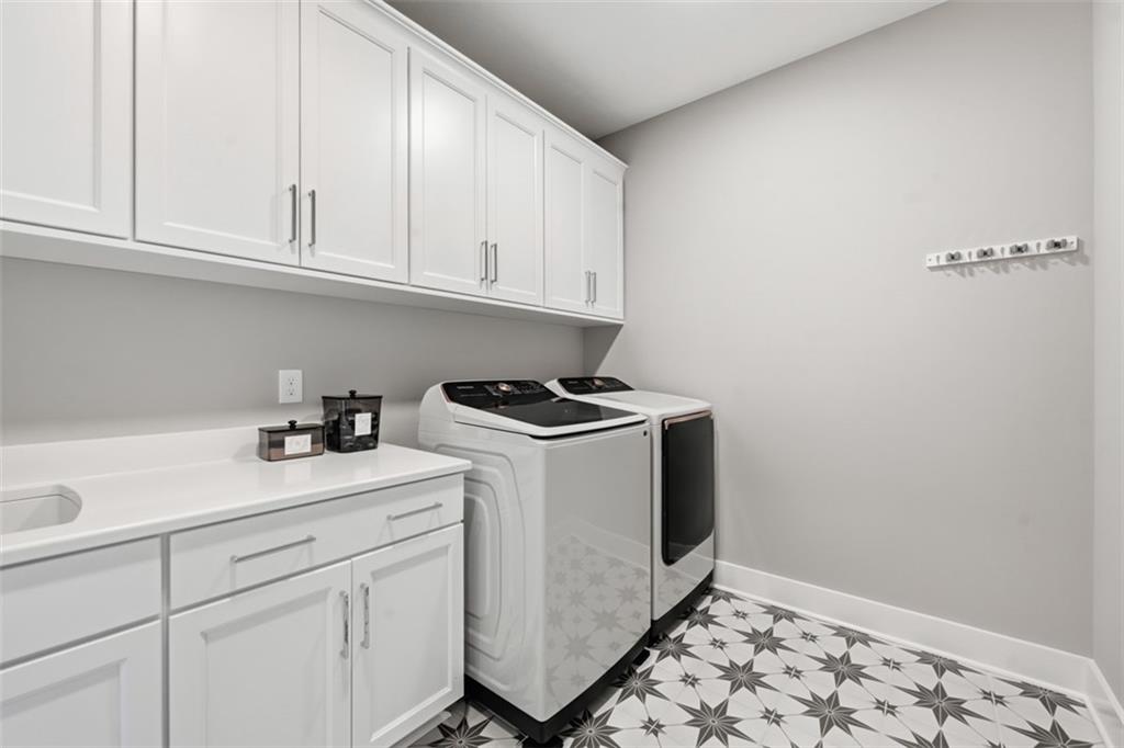 146 Enclave Drive Mars, PA 16046 - Photo 16 of 48 a utility room with sink dryer and washer