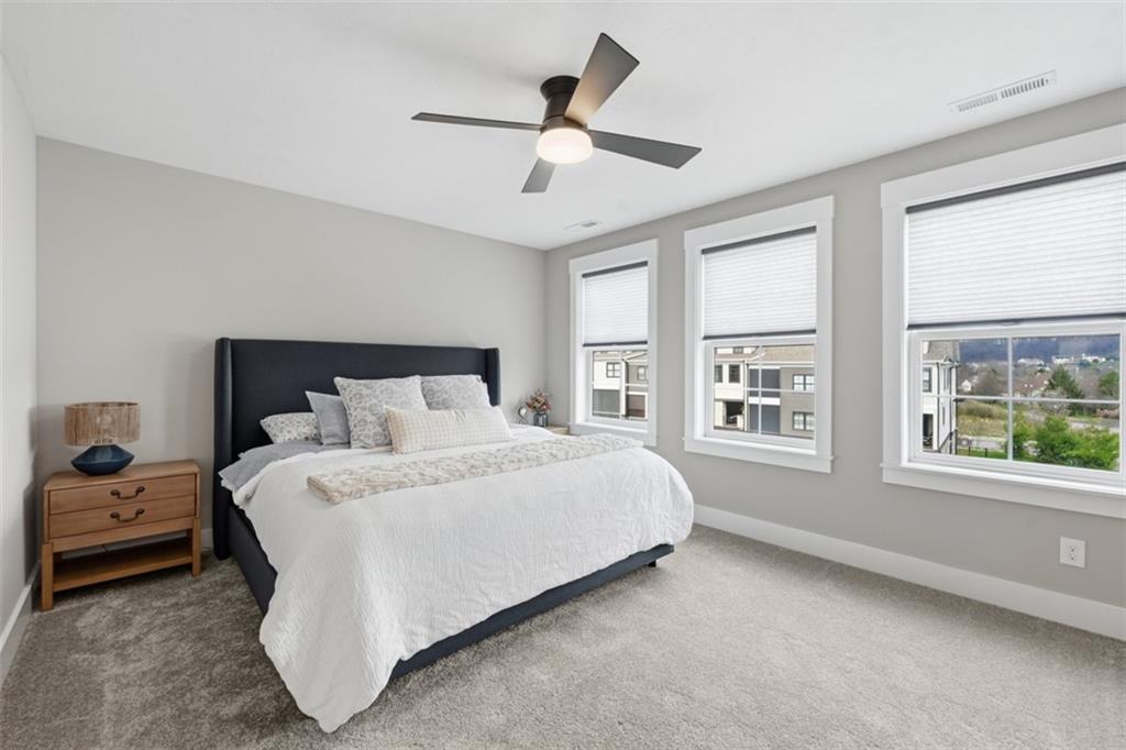 146 Enclave Drive Mars, PA 16046 - Photo 22 of 48 a spacious bedroom with a bed and a large window