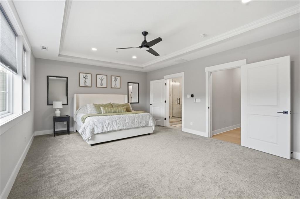 146 Enclave Drive Mars, PA 16046 - Photo 40 of 48 a spacious bedroom with a bed and a ceiling fan