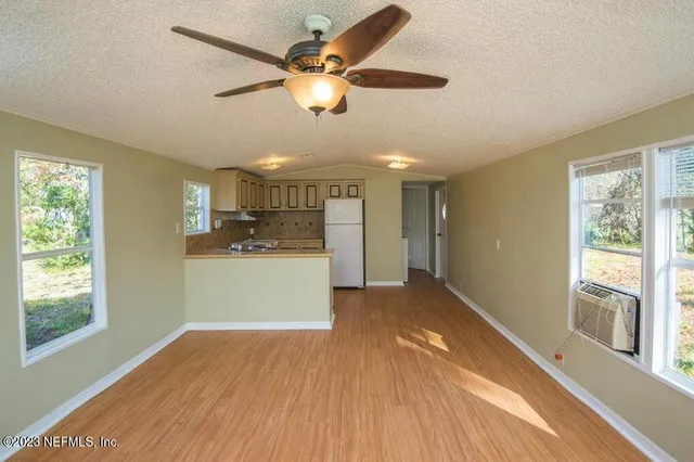 a kitchen with a stove a sink and a refrigerator