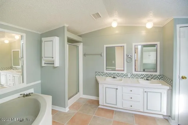 a bath tub sitting next to a white sink