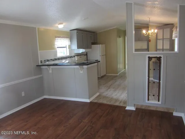 a kitchen with granite countertop a sink and a granite counter top