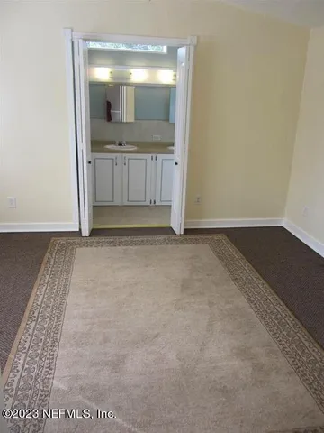 a white toilet sitting next to a small sink