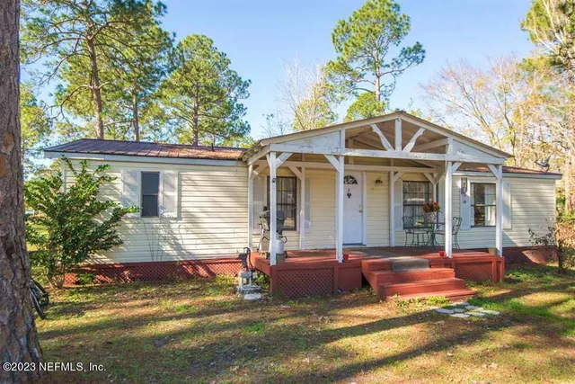 a front view of a house with a porch