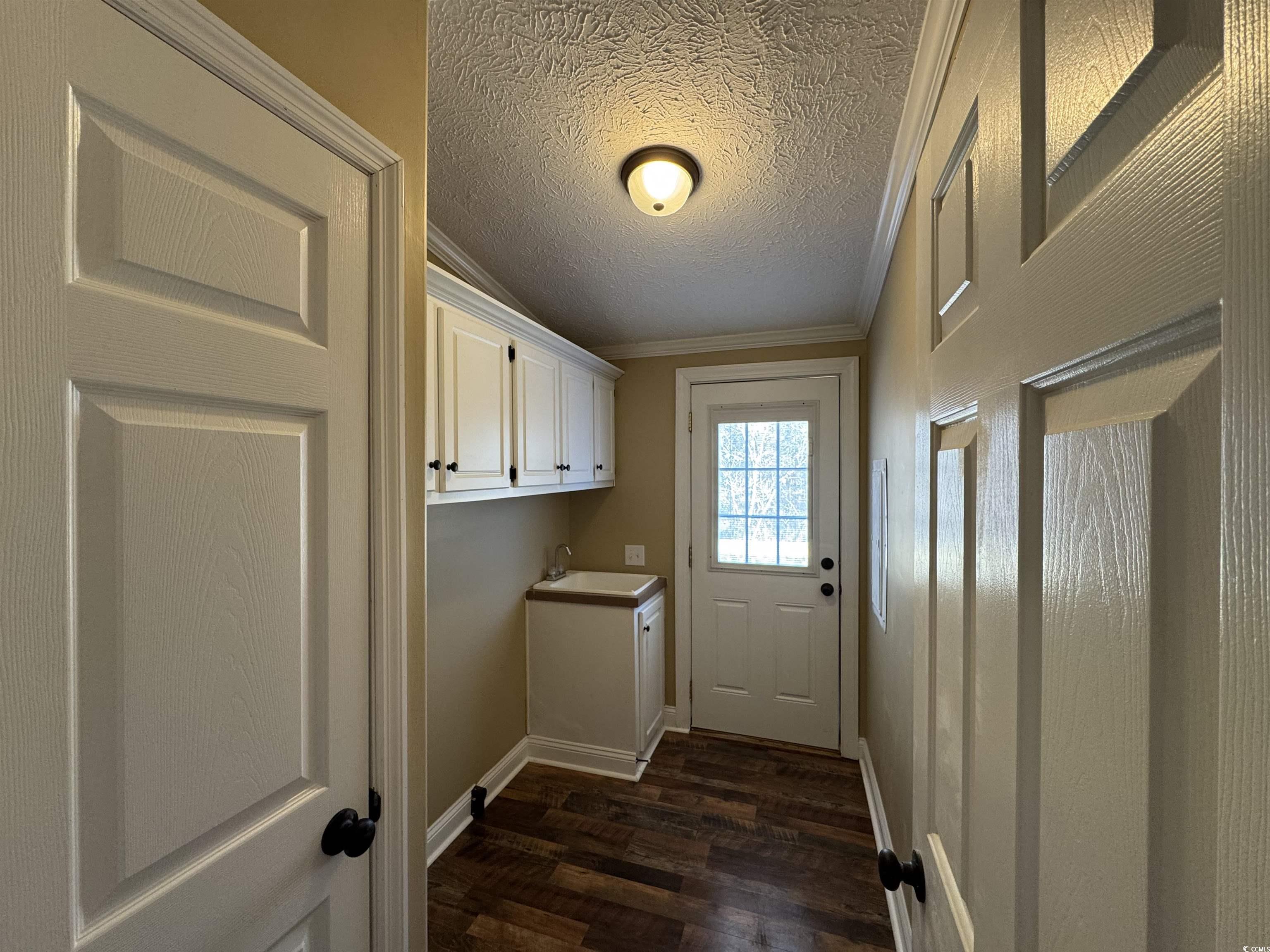 4092 Still Pond Road Conway, SC 29526 - Photo 36 of 39 Clothes washing area with sink, crown molding, dar