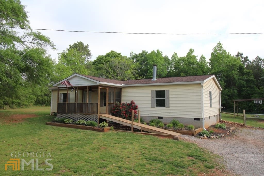 10 Goolsby Road Carrollton, GA 30117 - Photo 1 of 1 a front view of a house with garden