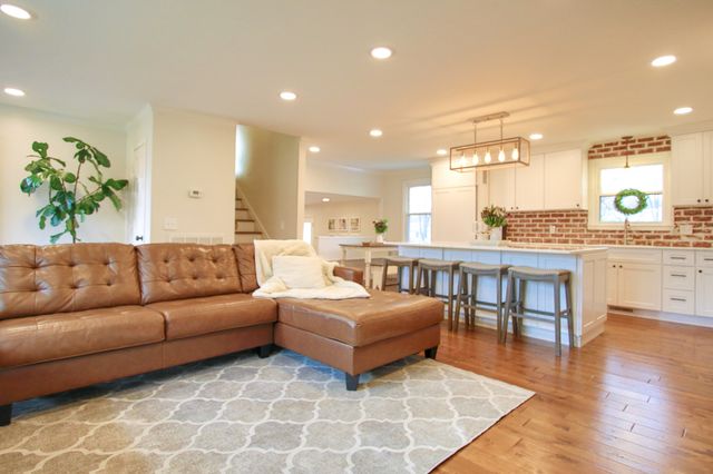 a living room with furniture and a table