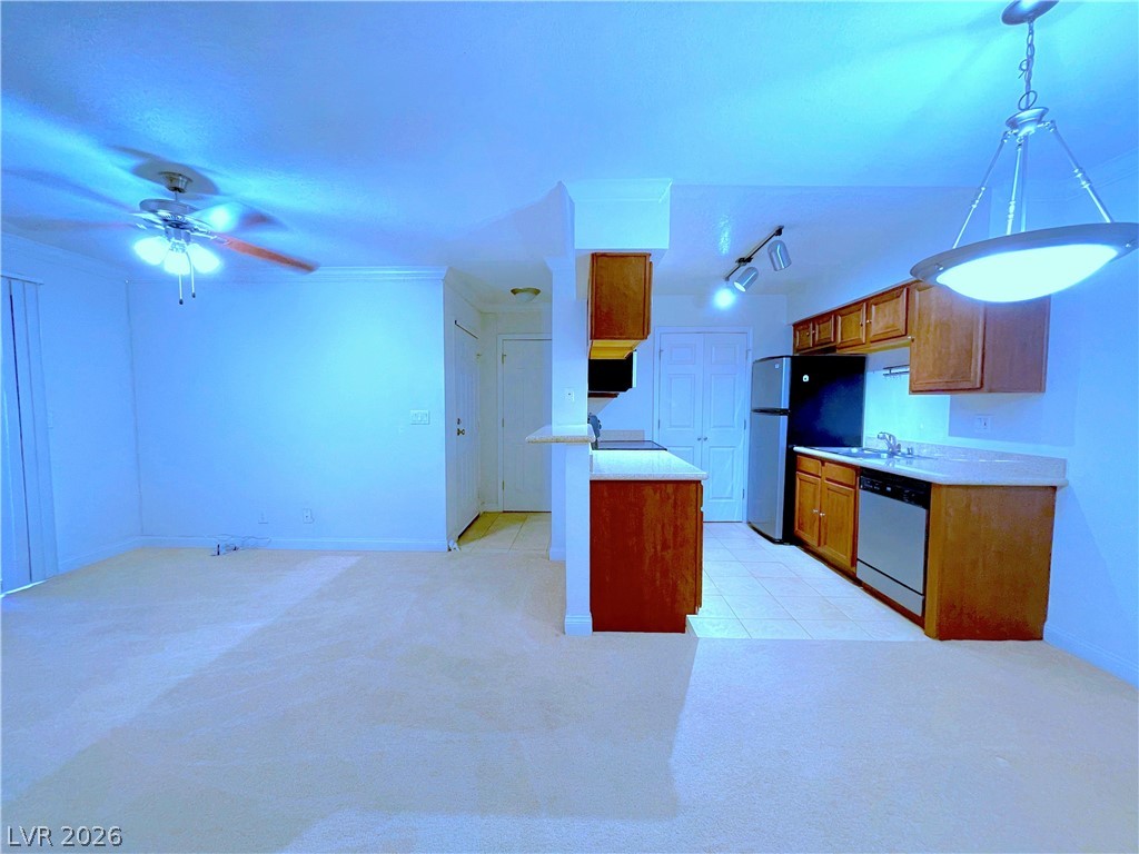 3135 South Mojave Road, Unit 156 Las Vegas, NV 89121 - Photo 4 of 18 An inviting open-concept area connects the living space with a functional kitchen.