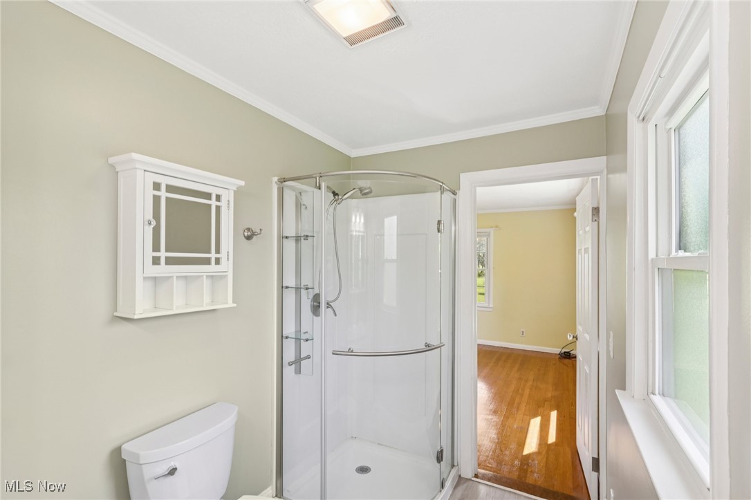 5097 Chillicothe Road Chagrin Falls, OH 44022 - Photo 29 of 45 Full bathroom with crown molding, a shower stall, and wood finished floors
