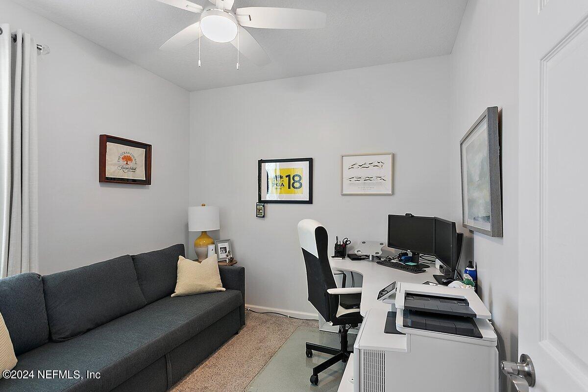 14720 Trellis Street Jacksonville, FL 32258 - Photo 13 of 21 a view of a livingroom with workspace and a couch