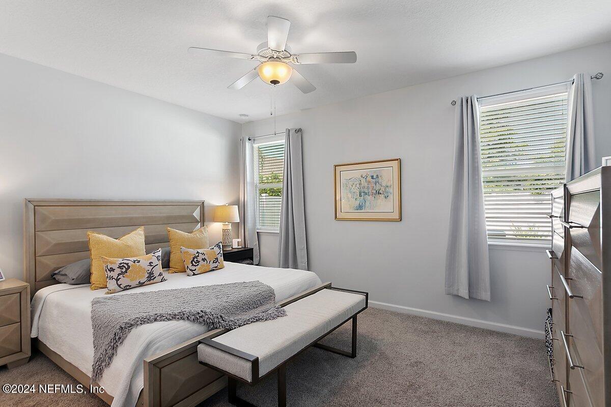 14720 Trellis Street Jacksonville, FL 32258 - Photo 15 of 21 a bedroom with a bed and a window