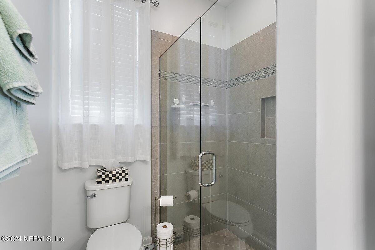 14720 Trellis Street Jacksonville, FL 32258 - Photo 17 of 21 a bathroom with a toilet sink and shower