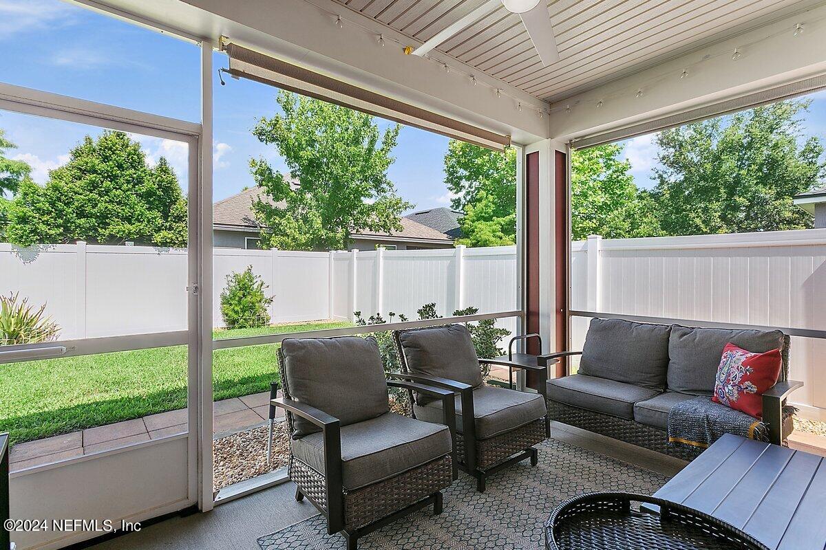14720 Trellis Street Jacksonville, FL 32258 - Photo 18 of 21 a balcony with furniture and a garden